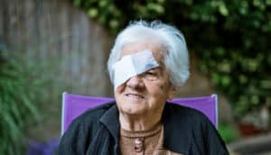older woman with eye patch - macular degeneration