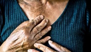 hands on chest (lung cancer concept)