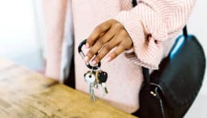 hand holds house keys - living with parents