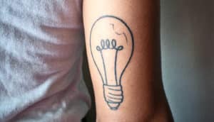light bulb tattoo on arm