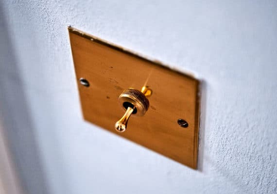 light switch toggle on wall (antibiotics concept)