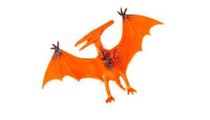 red pterodactyl toy on white