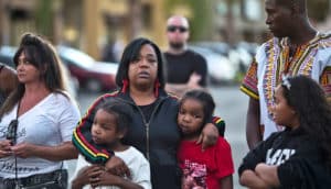 woman and two children at Alfred Olango protest