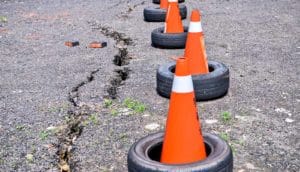 cracked pavement and cones (earthquakes concept)