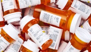 pill bottle pile (drug interactions concept)