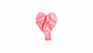 deflated pink heart balloon