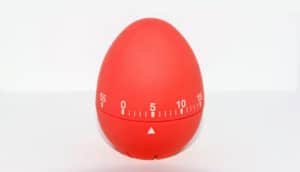 red egg timer on white - productivity