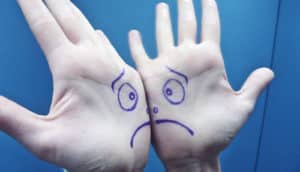 sad face on palms on hands - spanking