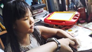 young girl learning (autism concept)