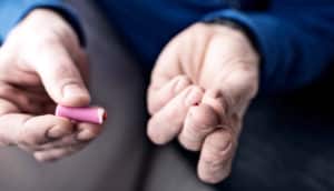 finger prick (type 1 diabetes concept)