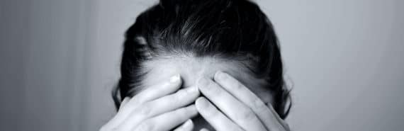 holding head during migraine