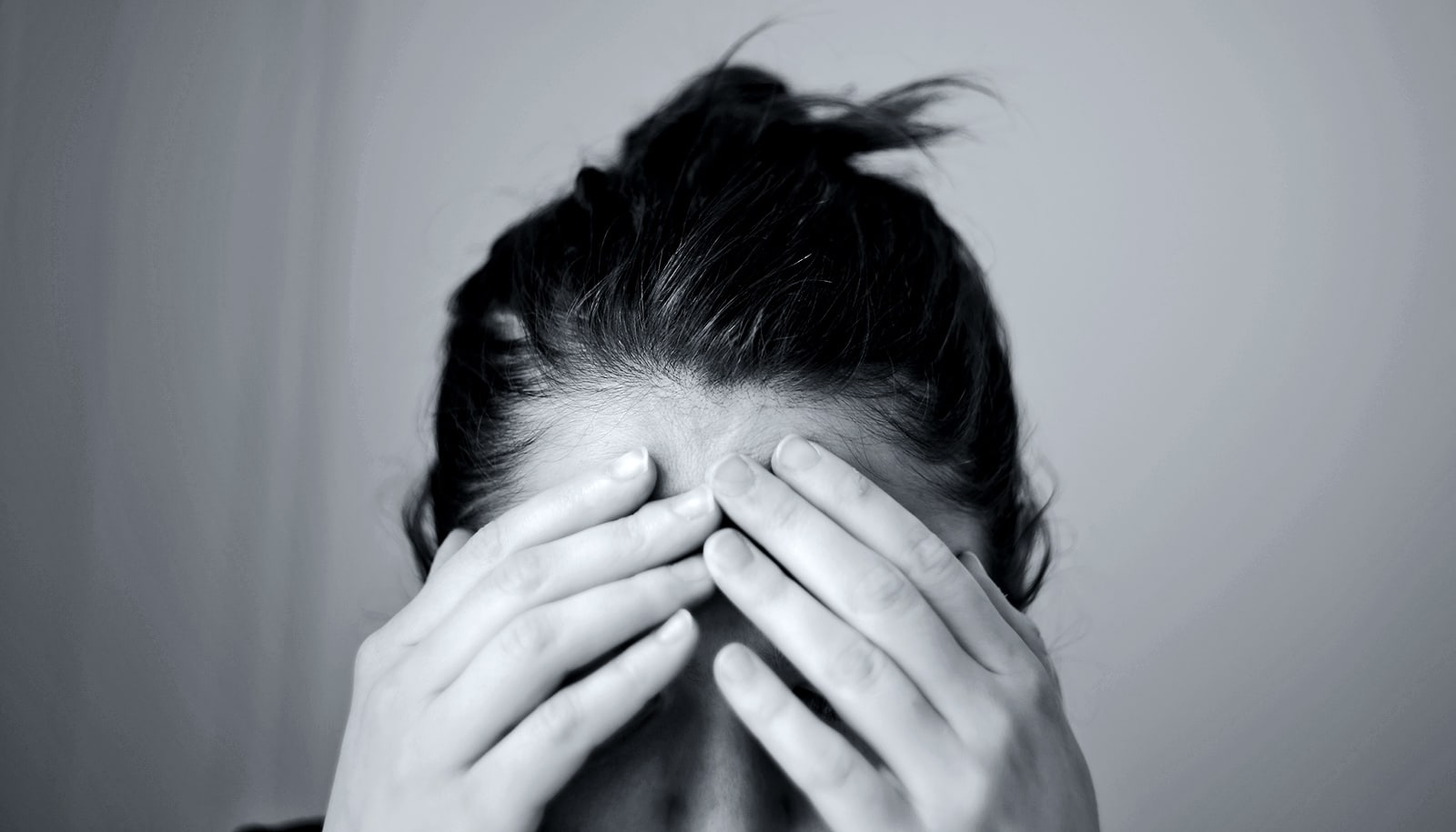 holding head during migraine