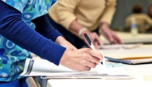 nurse filling out paperwork