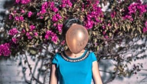 balloon obscures woman's face