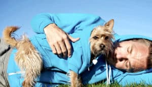 man and dog in matching hoodies