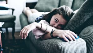 on the couch with the phone