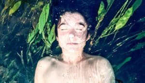 boy underwater in river - microbiomes