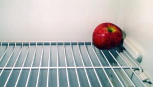 apple in empty fridge