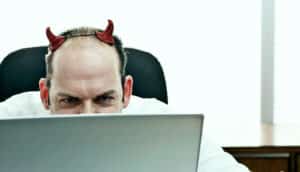 devil horns on computer user (quantum computers concept)