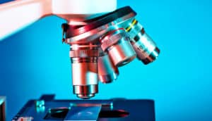 microscope against blue (myelodysplastic syndrome concept)