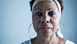 woman looking into camera (breast cancer concept)