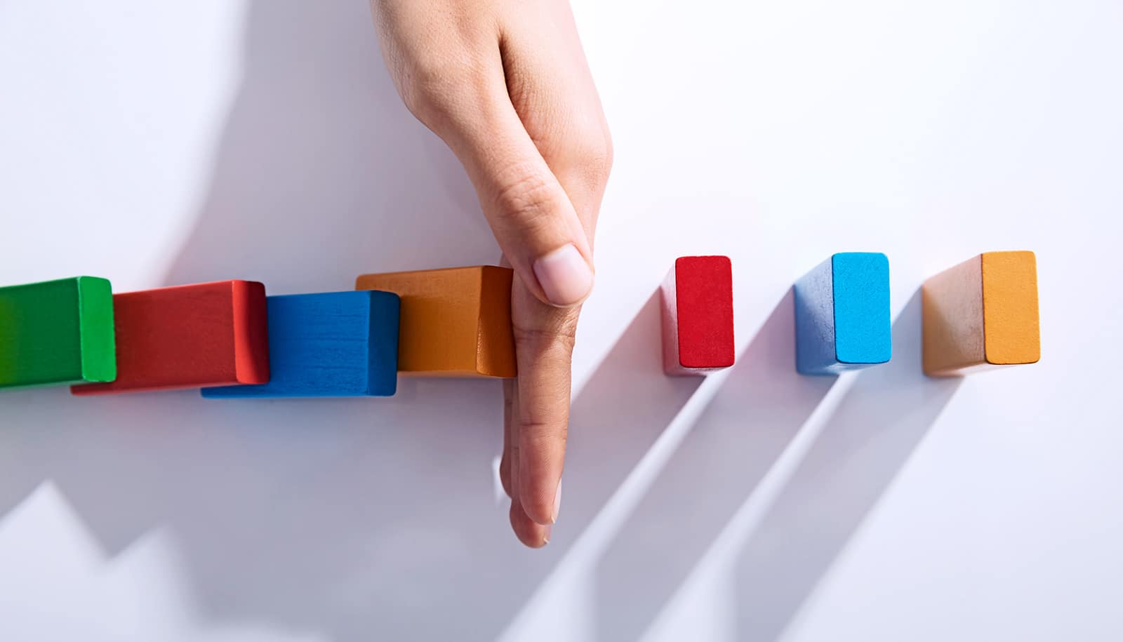 breaking dominos line