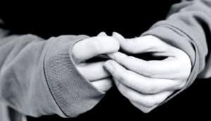 nervous hands close-up (sexual abuse concept)