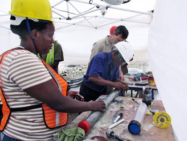 scientists in a tent