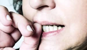 woman biting fingernails