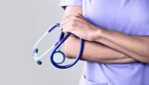 woman in scrubs (nurse practitioners concept)