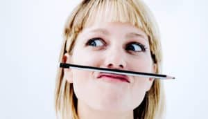 woman thinking with pencil mustache (ADHD concept)