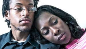 couple mourning (infertility concept)