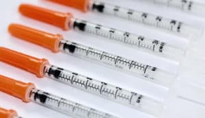 syringes in a row (colon + diabetes concept)