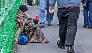 man sitting on street