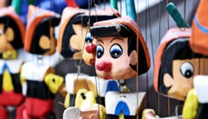 Pinocchio puppets (lying concept)