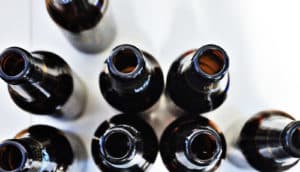 beer bottles from above on white