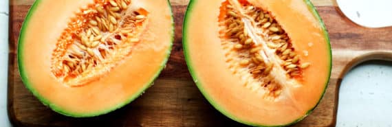 melon halves on cutting board