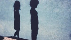 shadows of two children on blue wall - children's deaths