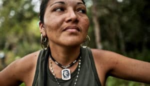 FARC rebel poses with Che necklace