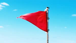 red flag against blue sky (prostate cancer concept)