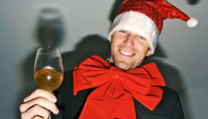 man in santa hat with drink