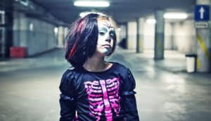 young girl in skeleton costume (bones concept)