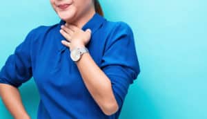 woman in blue with acid reflux