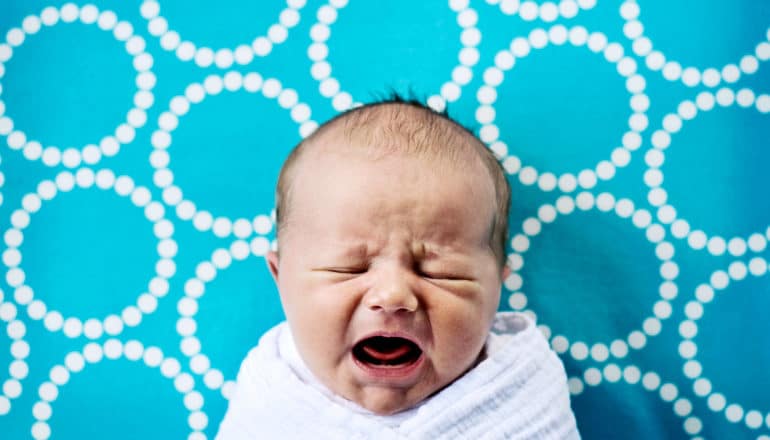 baby on blue blanket