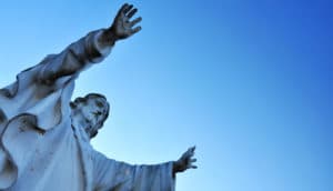 jesus statue against blue sky