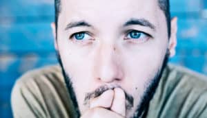 man with blue eyes thinking (blood pressure concept)