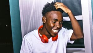 guy wearing red headphones around neck