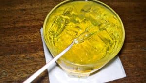 yellow drink with straw (alcohol concept)