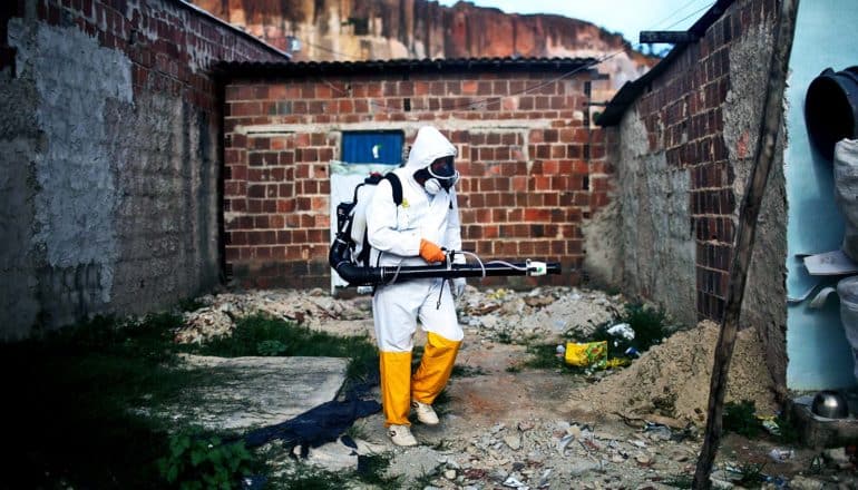 A city worker fumigates in Recife, Pernambuco state, Brazil