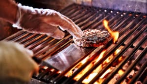 cooking burger on grill (pollution concept)